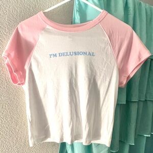 "i'm delusional" baseball cropped baby tee